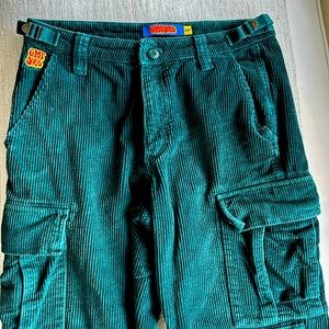 Empire green cords. Like new worn 1x Sz 28. Needs tiny fix on belt loop. See pic
